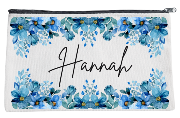 Three personalized pouches with A name written on them, adorned with different floral designs.