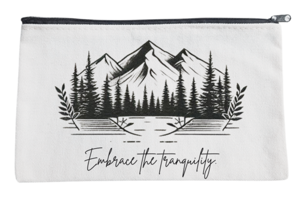 An 8.3x5 inch versatile bag featuring a serene mountain and forest design with the phrase “Embrace the tranquility.”