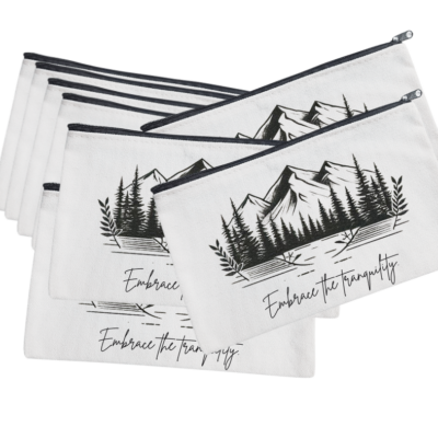 An 8.3x5 inch versatile bag featuring a serene mountain and forest design with the phrase “Embrace the tranquility.”